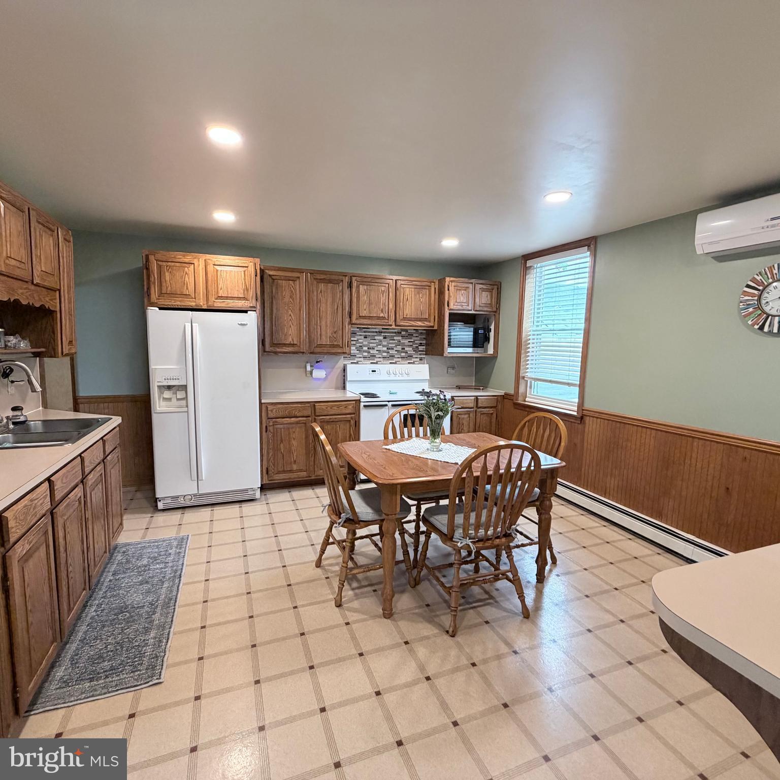 12997 Main Street Fort Loudon, PA 17224 - Photo 12 of 48 a view of kitchen with refrigerator dining table and chairs
