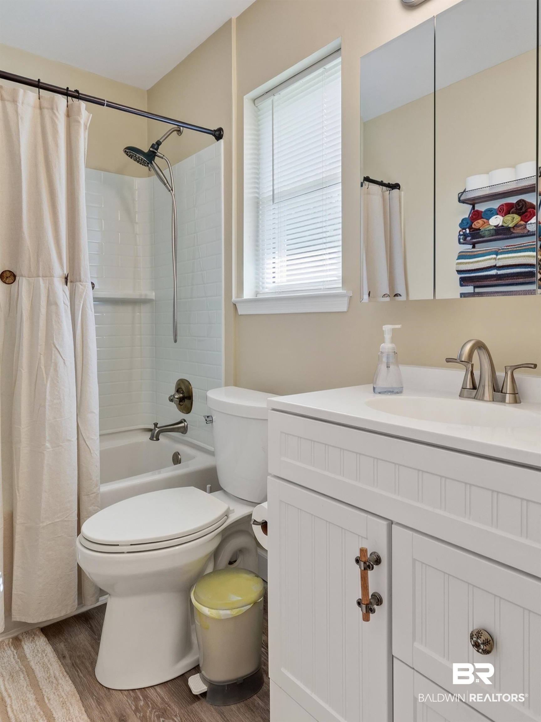 1271 Spring Valley Drive South Mobile, AL 36693 - Photo 37 of 56 Full bath featuring vanity, light wood-style floors, and shower / bathtub combination with curtain