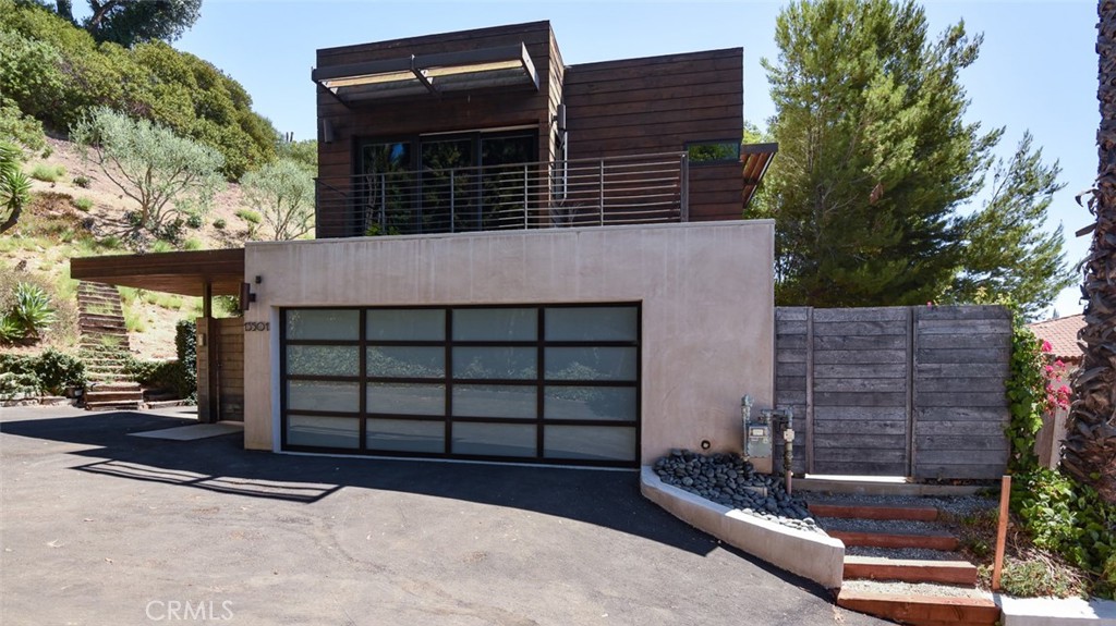 a front view of a house with a garage