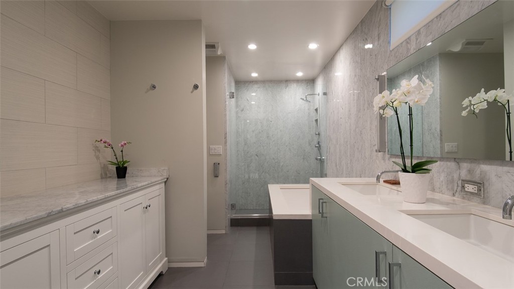 13501 Bayliss Road Brentwood, CA 90049 - Photo 14 of 24 a bathroom with a sink a toilet and a mirror