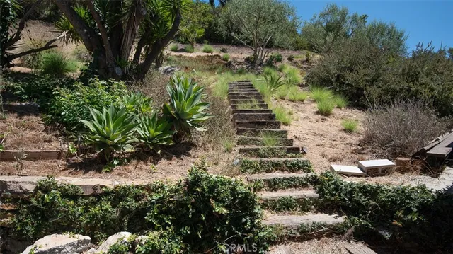 a room with wooden floor and glass door