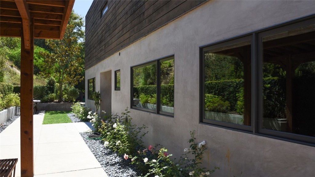13501 Bayliss Road Brentwood, CA 90049 - Photo 23 of 24 a front view of a house with garden