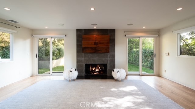 13501 Bayliss Road Brentwood, CA 90049 - Photo 4 of 24 a living room with furniture and a fireplace
