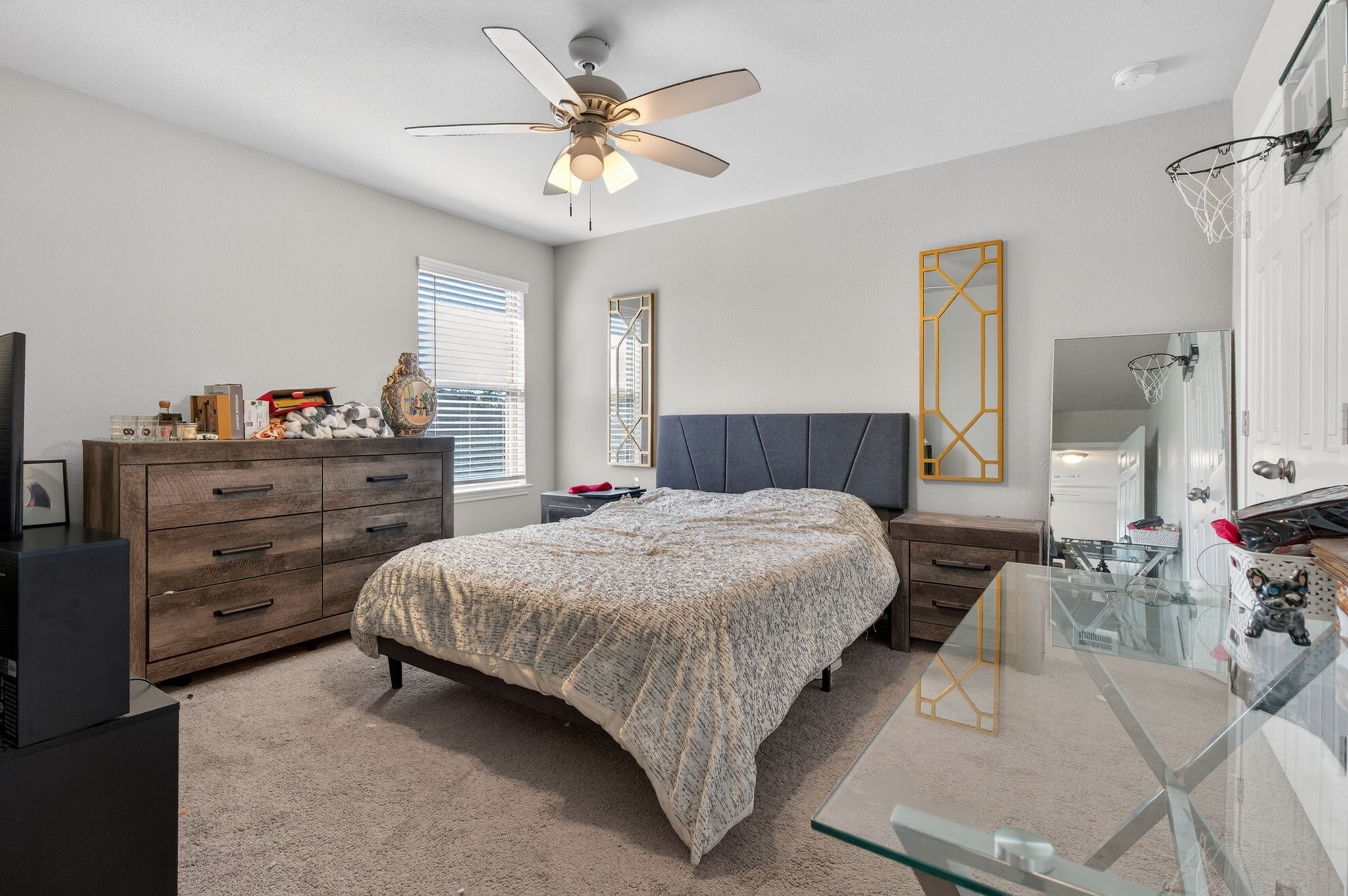 2121 Cedar Way Drive Conroe, TX 77301 - Photo 19 of 27 a bedroom with a bed and a chandelier