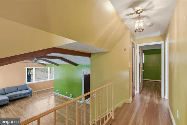 a view of a livingroom with furniture and staircase