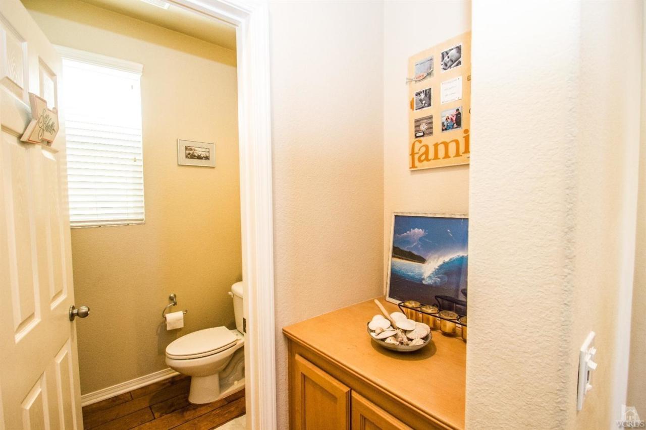 3153 North Ventura Road Oxnard, CA 93036 - Photo 14 of 45 a bathroom with a toilet sink and mirror
