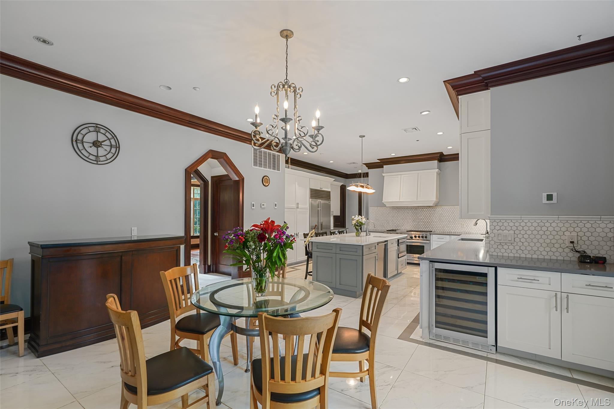 3747 Purchase Street Purchase, NY 10577 - Photo 11 of 48 a view of a dining room with furniture and chandelier