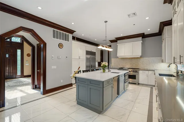 a kitchen with a sink counter top space and appliances
