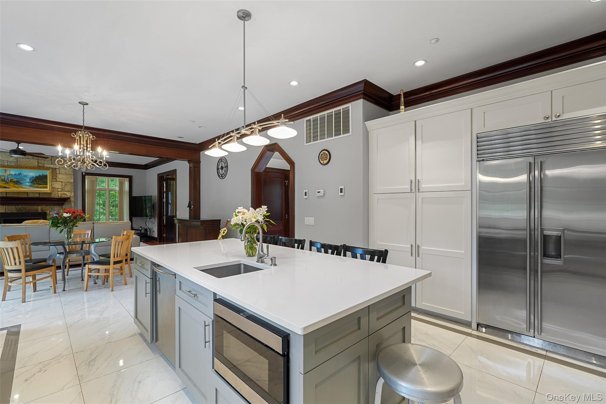 3747 Purchase Street Purchase, NY 10577 - Photo 13 of 48 a kitchen with a stove a refrigerator and a dining table with wooden floor