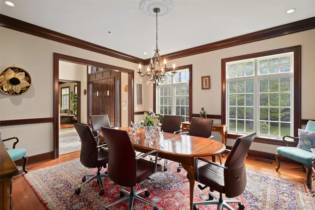 a view of a dining room with furniture window and wooden floor