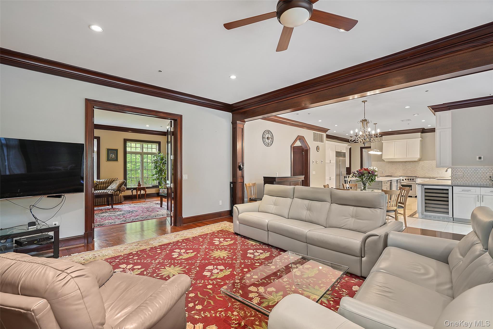 3747 Purchase Street Purchase, NY 10577 - Photo 17 of 48 a living room with furniture and a flat screen tv
