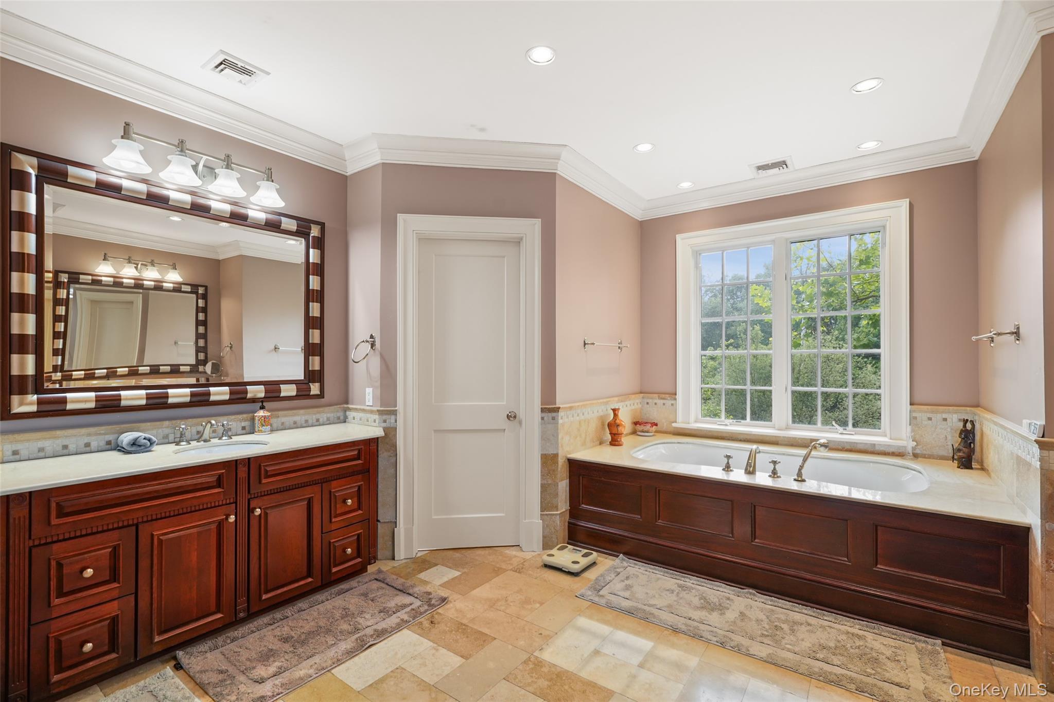 3747 Purchase Street Purchase, NY 10577 - Photo 23 of 48 a spacious bathroom with a large tub sink and double vanity