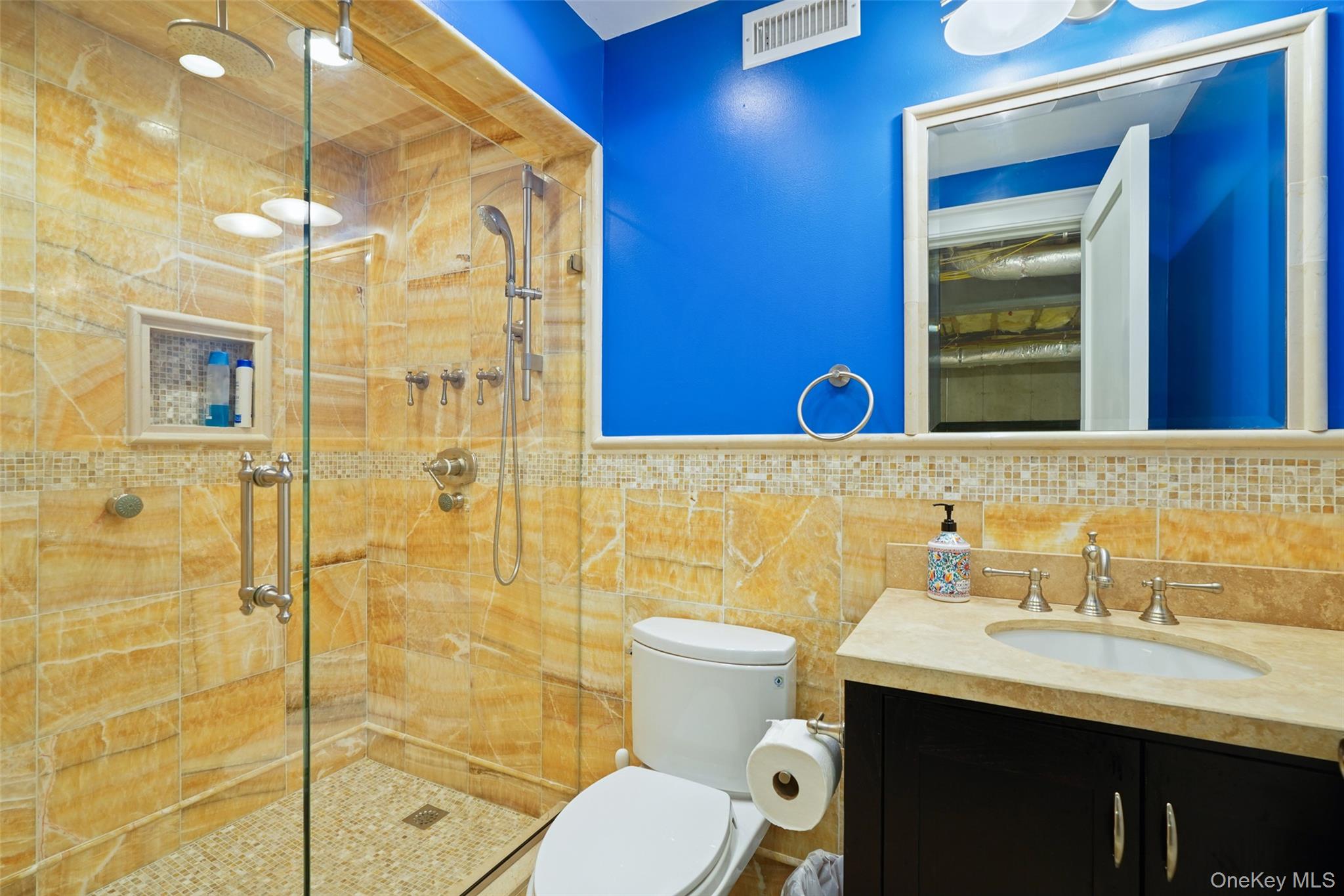 3747 Purchase Street Purchase, NY 10577 - Photo 32 of 48 a bathroom with a sink a toilet and shower