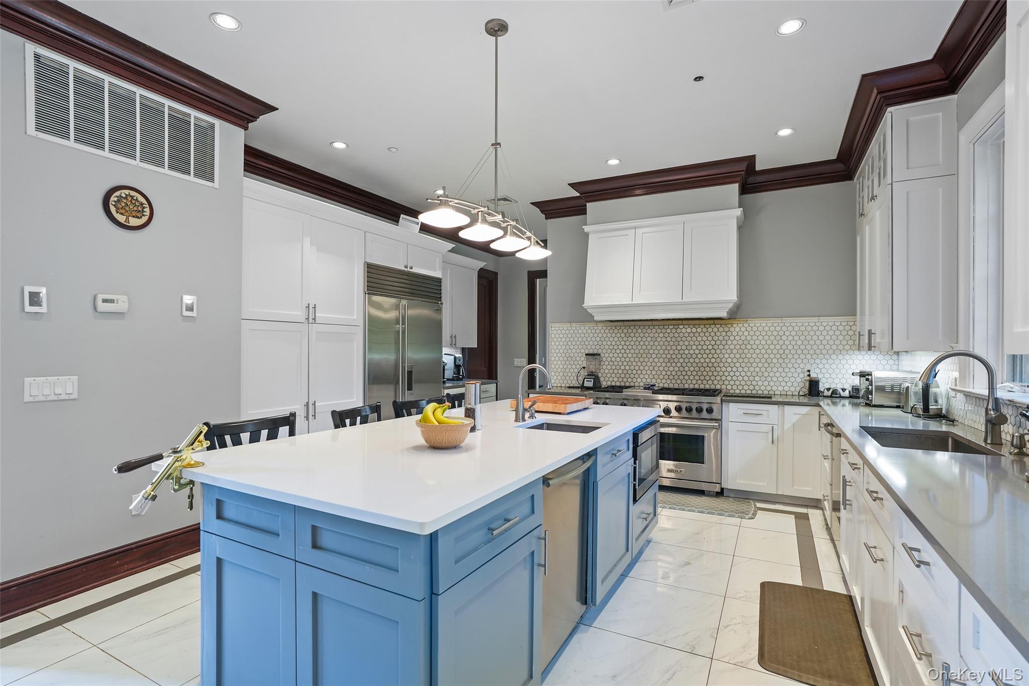 3747 Purchase Street Purchase, NY 10577 - Photo 10 of 48 a kitchen with a sink a stove and cabinets