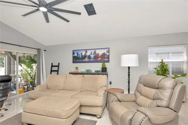 a living room with furniture and a large window