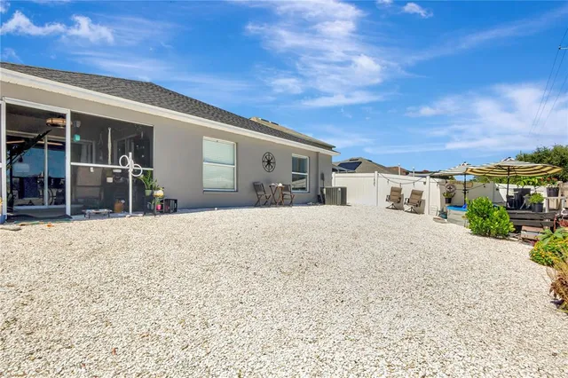 a view of a house with a snow in the yard