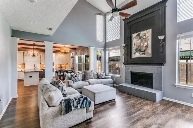 a living room with furniture and a fireplace