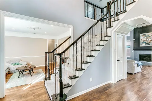 a view of entryway and hall with wooden floor