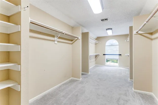 a view of a room with a wooden floor