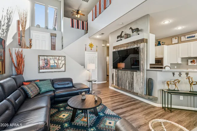 a view of a livingroom with furniture and wooden floor