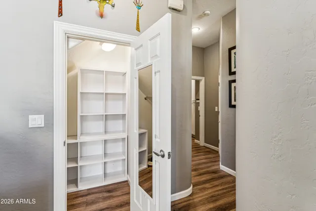 a white toilet sitting next to a shower