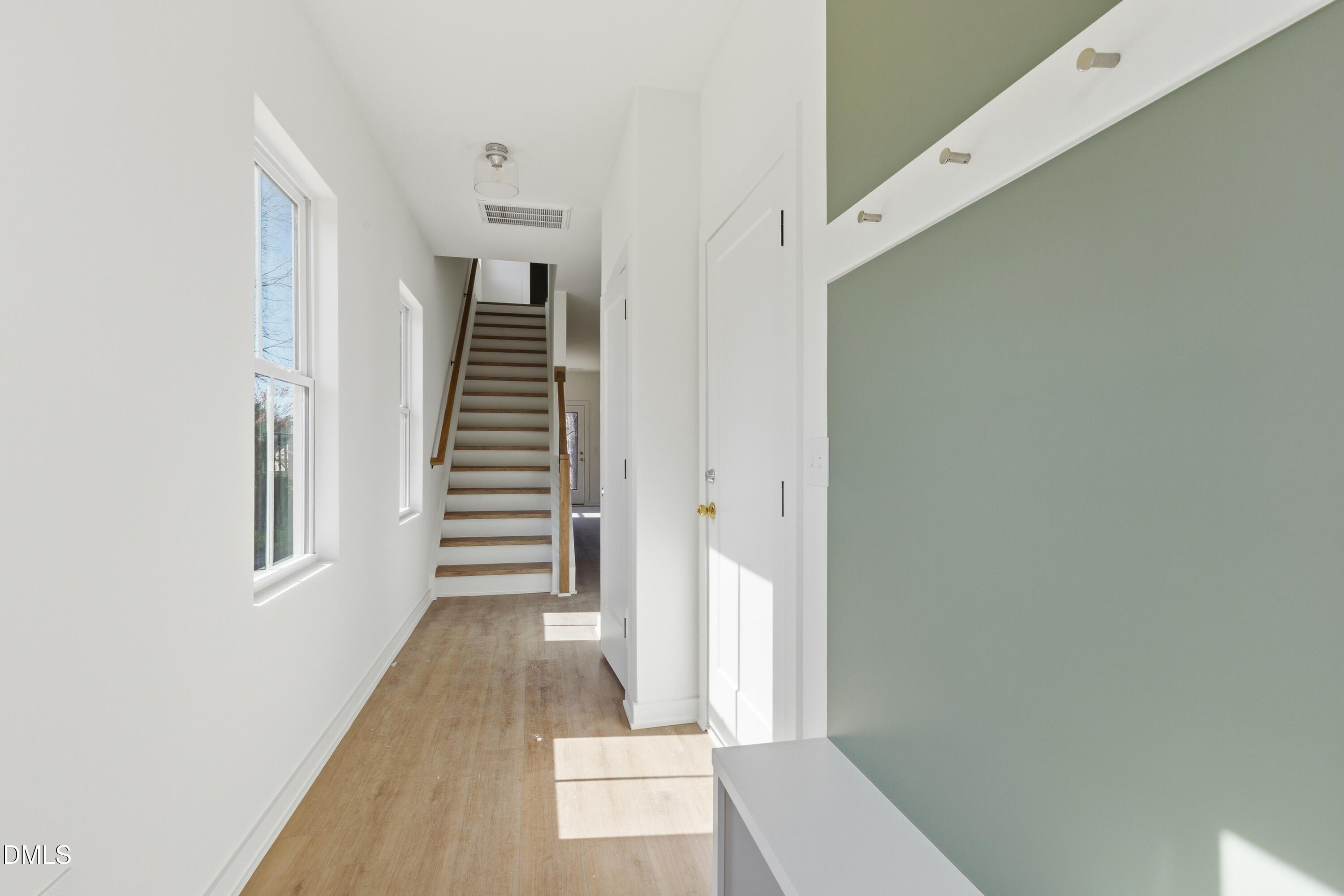 3814 Granite Mill Way Raleigh, NC 27616 - Photo 19 of 48 a view of a hallway with entryway and stairs