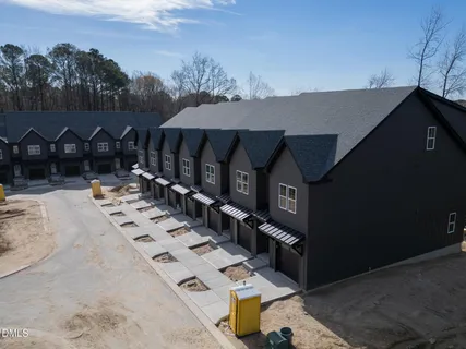 a bedroom with a bed chair and window