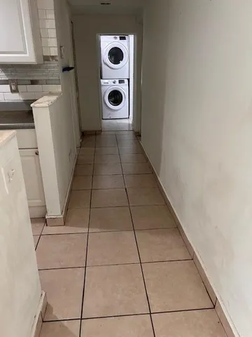 a kitchen with a cabinets and a stove top oven