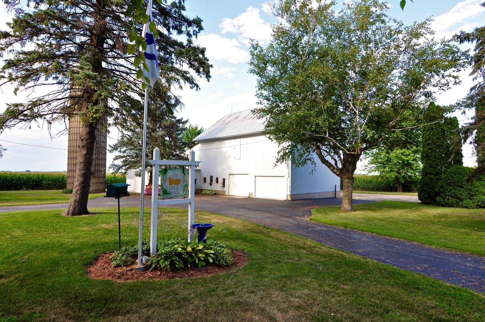 16053 Owens Road Hinckley, IL 60520 - Photo 11 of 68 a view of a garden with a tree