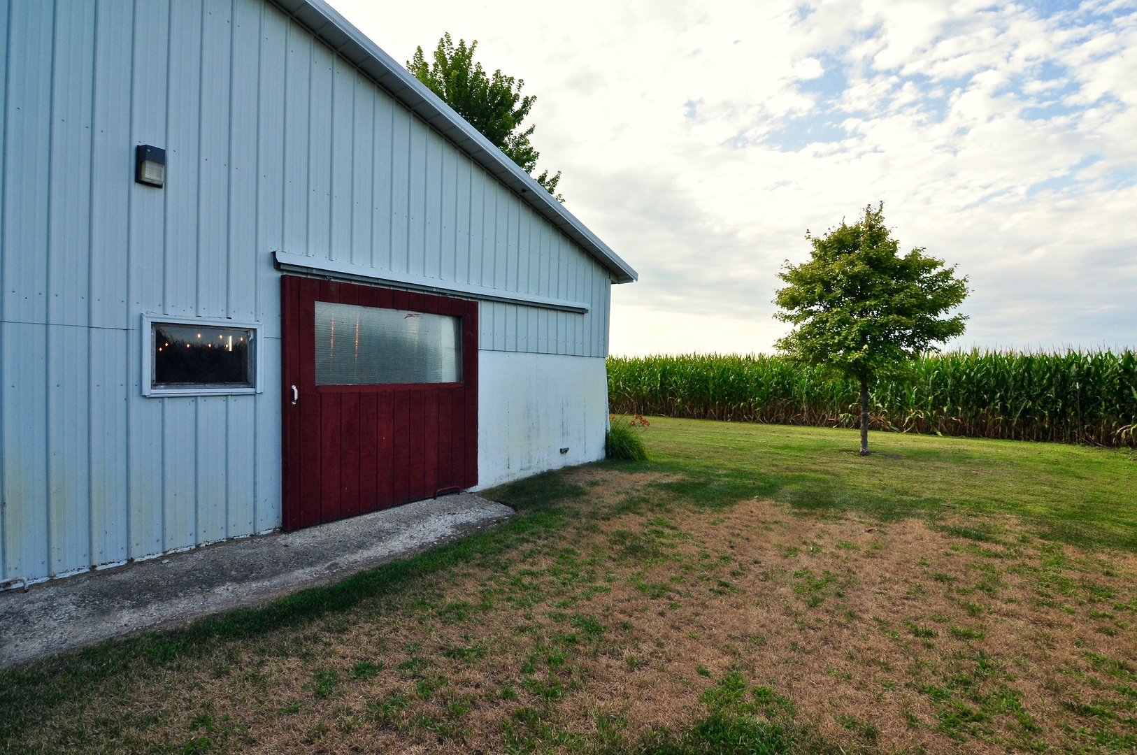 16053 Owens Road Hinckley, IL 60520 - Photo 16 of 68 a backyard of a house with plants and wooden fence