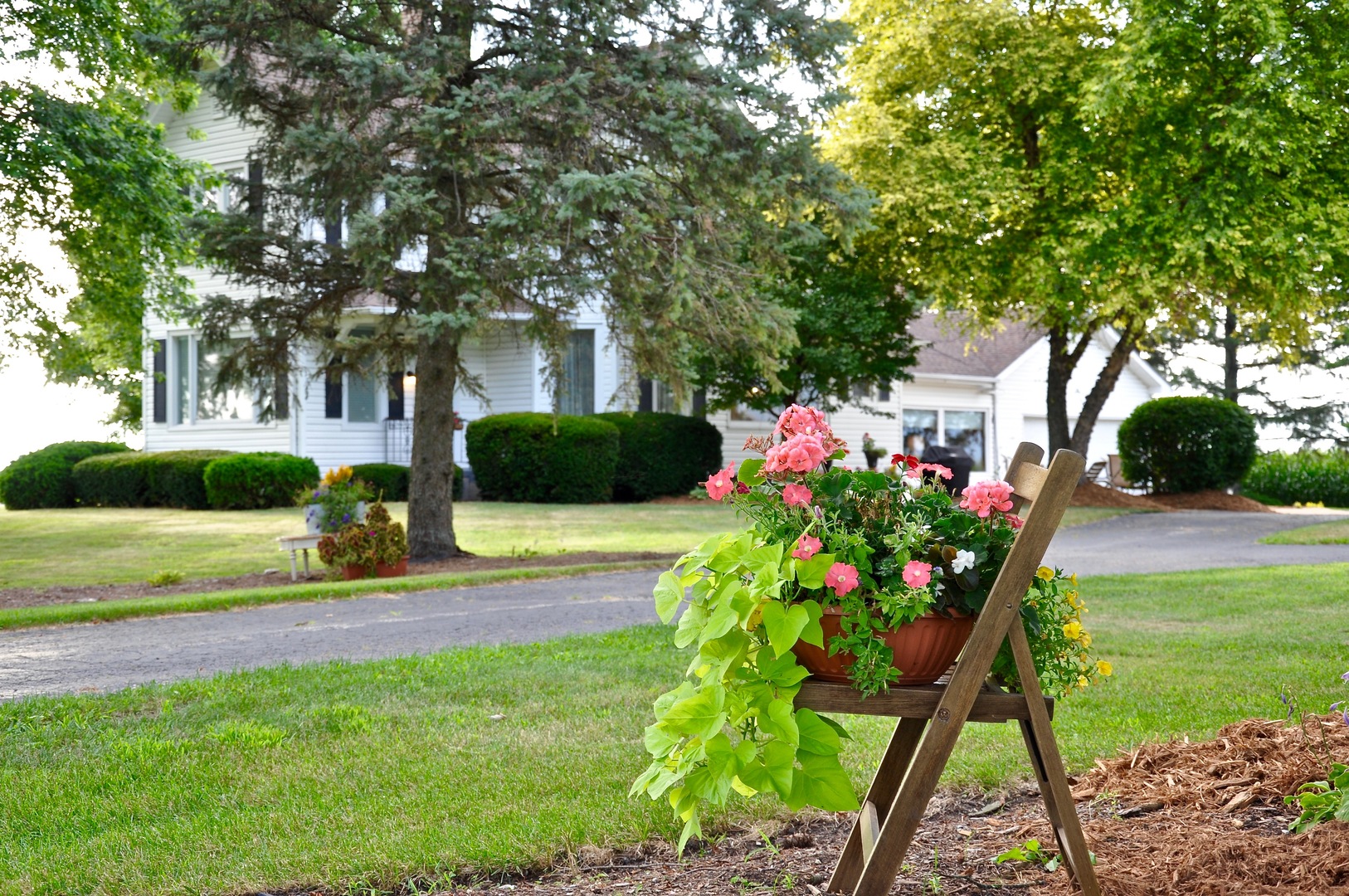 16053 Owens Road Hinckley, IL 60520 - Photo 25 of 68 a front view of a house with garden