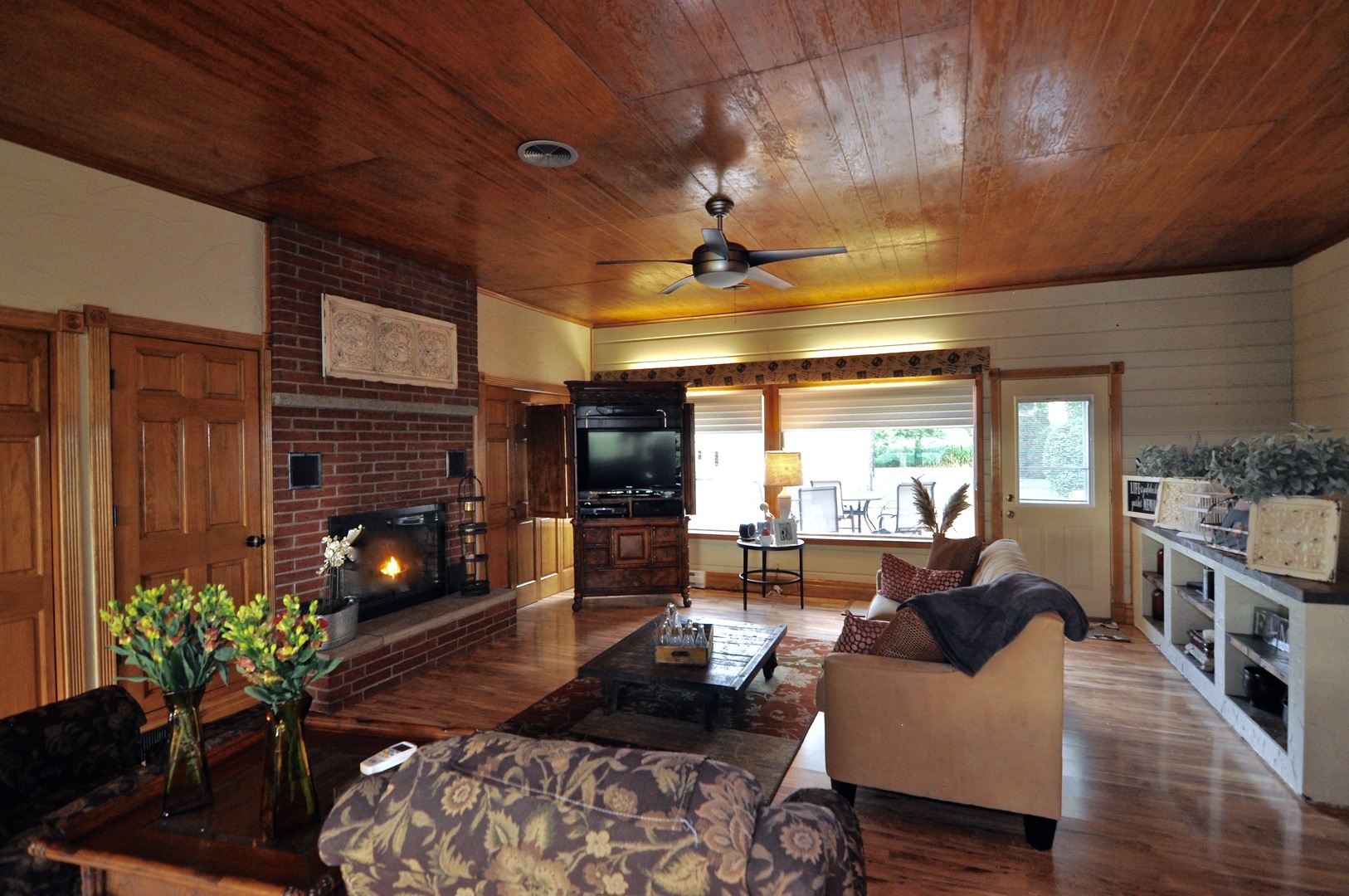 16053 Owens Road Hinckley, IL 60520 - Photo 27 of 68 a living room with furniture and a fireplace