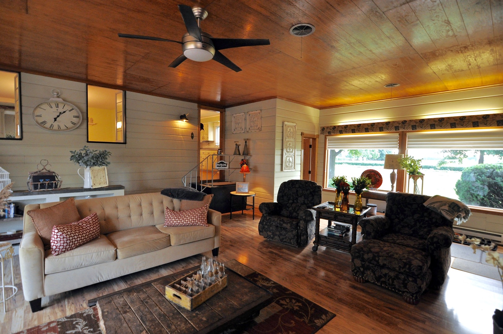 16053 Owens Road Hinckley, IL 60520 - Photo 30 of 68 a living room with furniture a chandelier and a large window