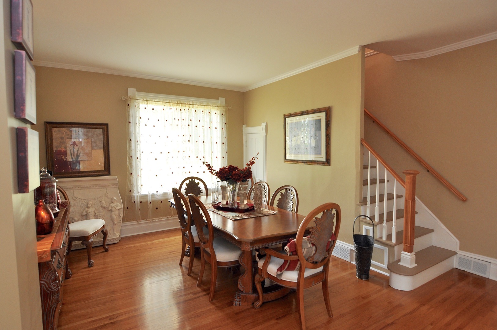 16053 Owens Road Hinckley, IL 60520 - Photo 35 of 68 a dining room with furniture a window and wooden floor