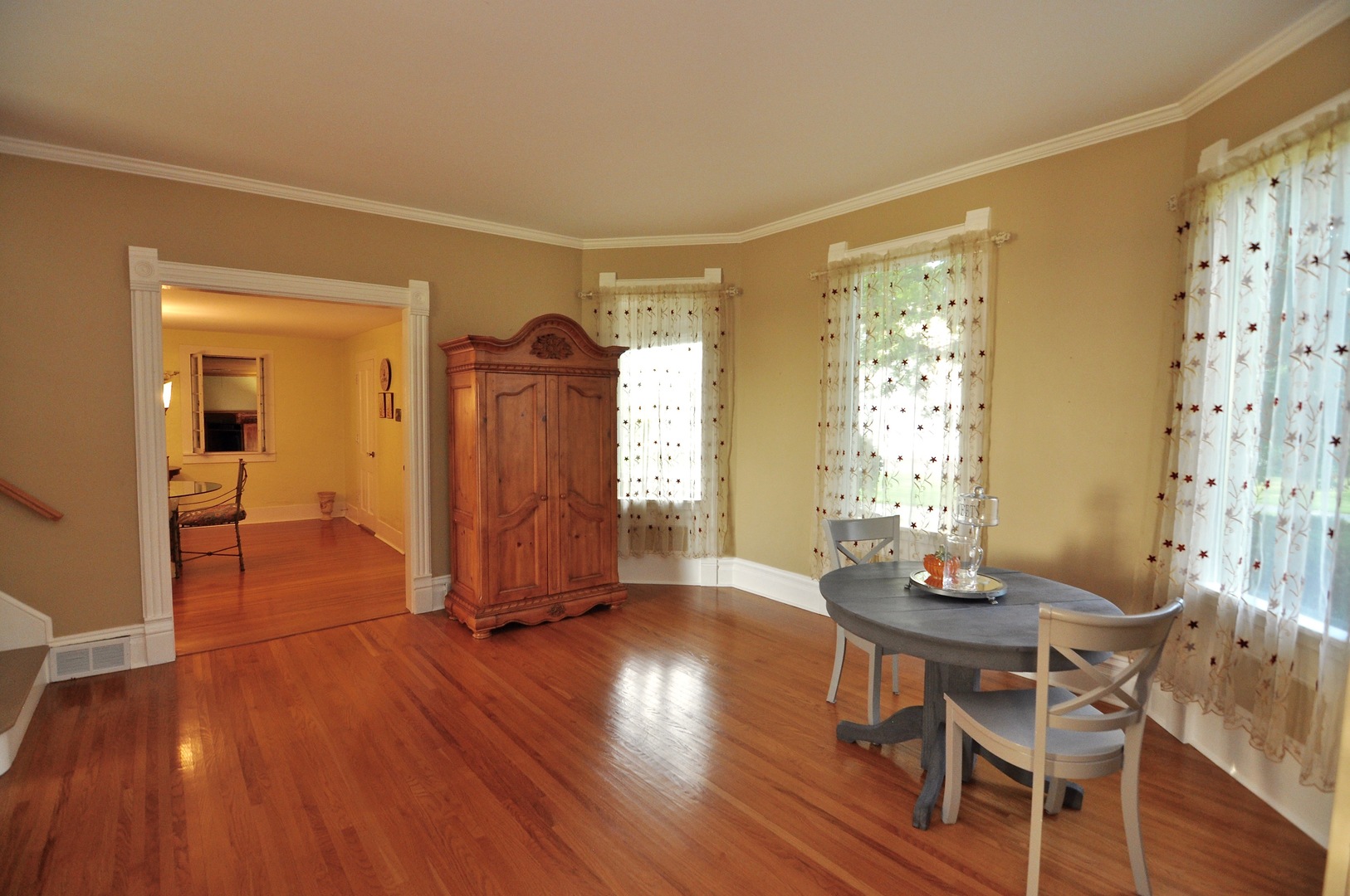16053 Owens Road Hinckley, IL 60520 - Photo 37 of 68 a view of a dining room with furniture and wooden floor