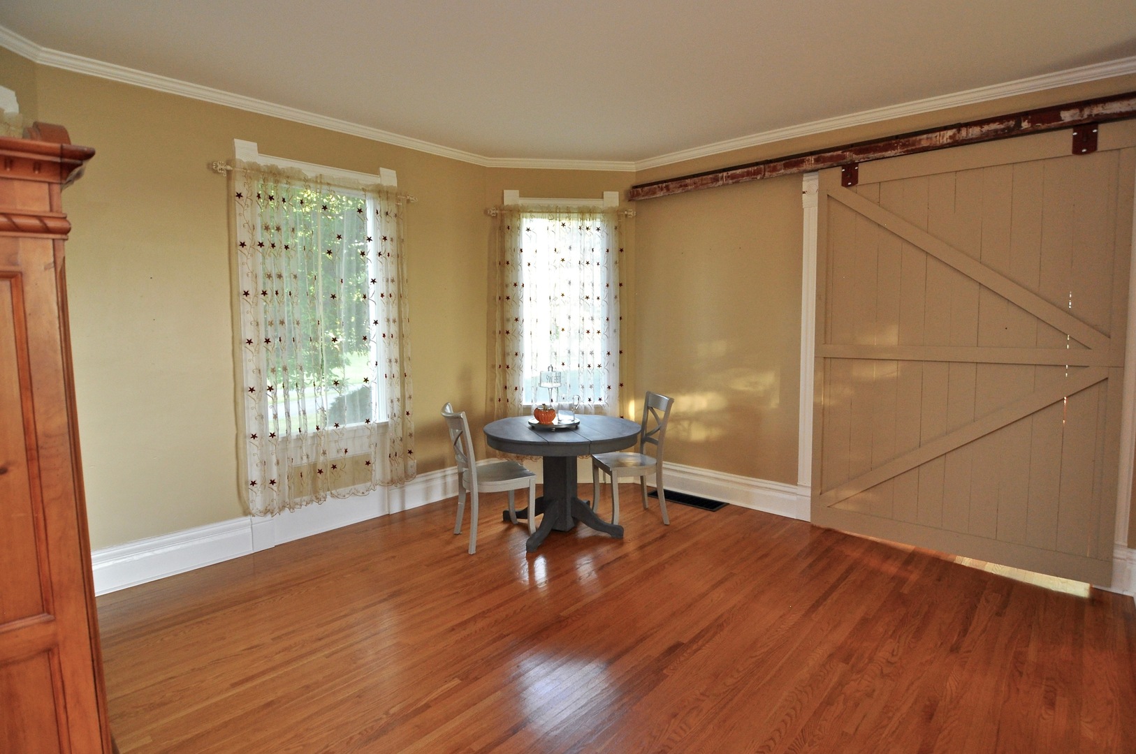 16053 Owens Road Hinckley, IL 60520 - Photo 40 of 68 a view of a livingroom with furniture window and wooden floor