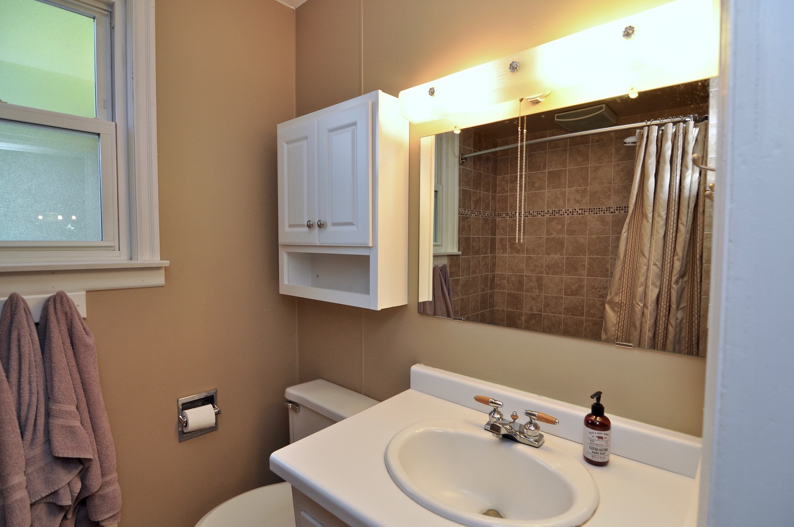 16053 Owens Road Hinckley, IL 60520 - Photo 50 of 68 a bathroom with a sink and mirror