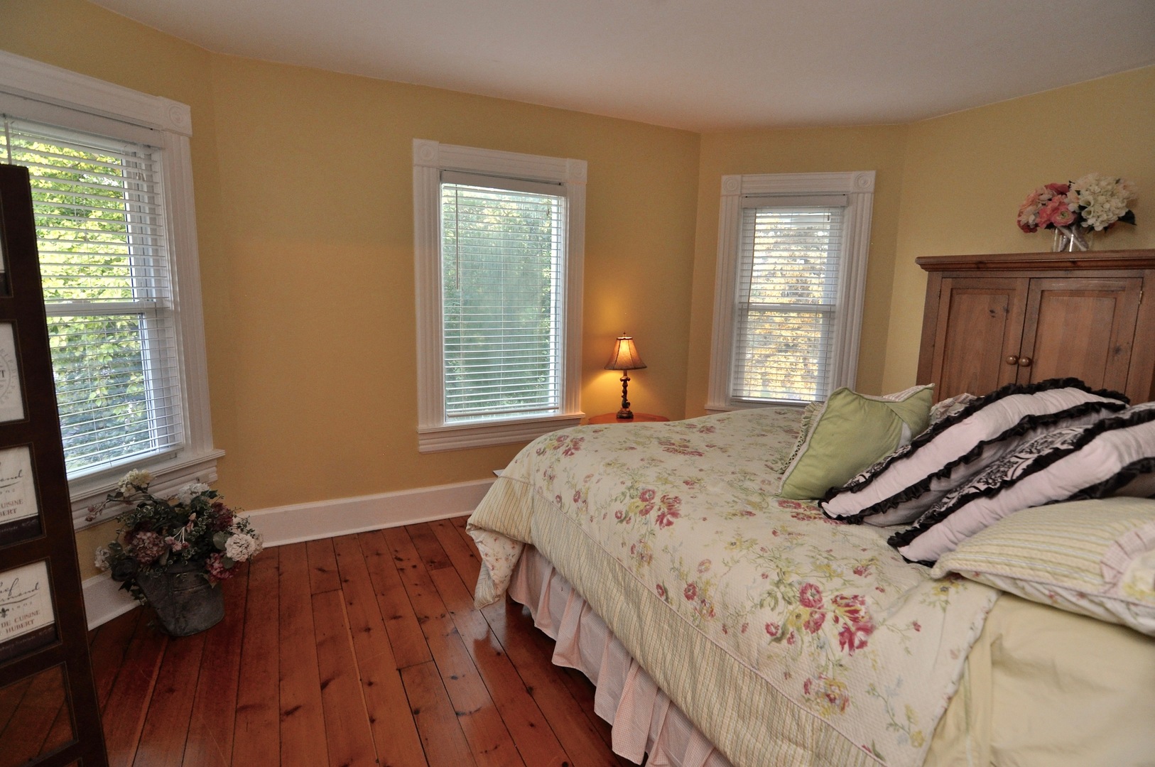 16053 Owens Road Hinckley, IL 60520 - Photo 57 of 68 a bedroom with a bed and wooden floor