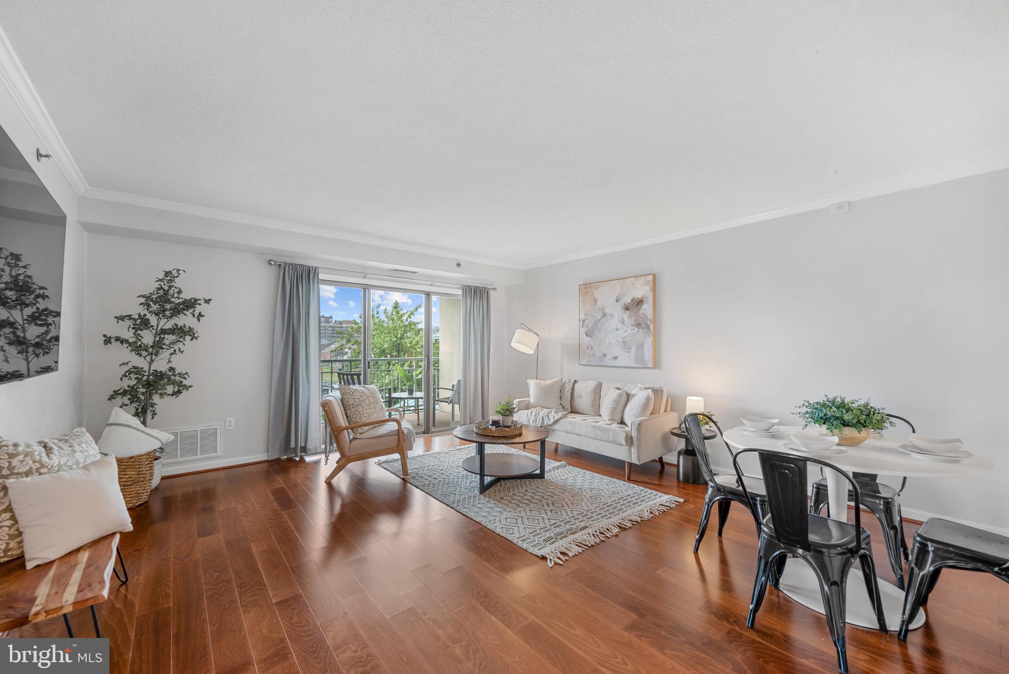 545 East Braddock Road, Unit 302 Alexandria, VA 22314 - Photo 1 of 36 a living room with furniture and a large window