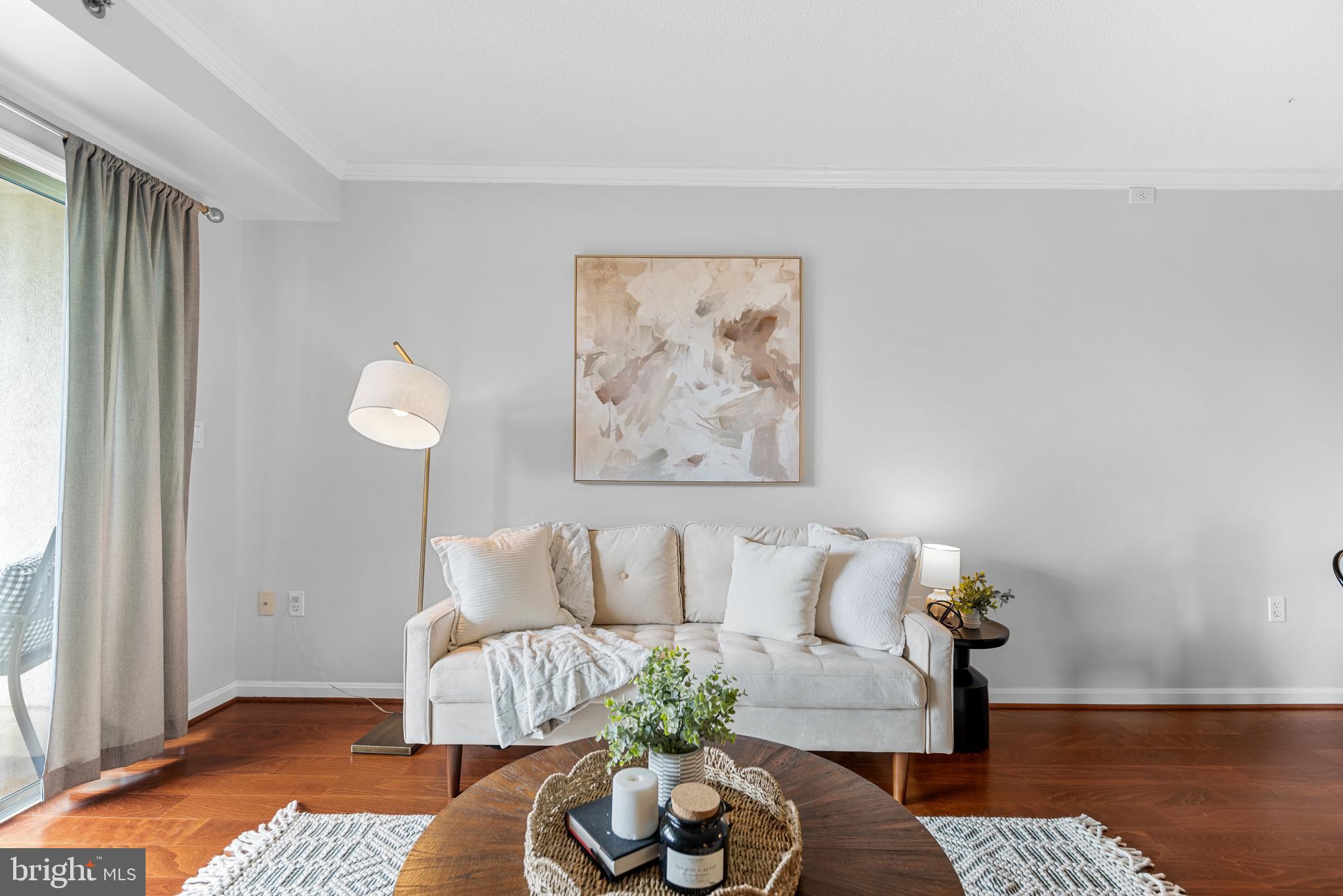 545 East Braddock Road, Unit 302 Alexandria, VA 22314 - Photo 5 of 36 a living room with furniture and wooden floor