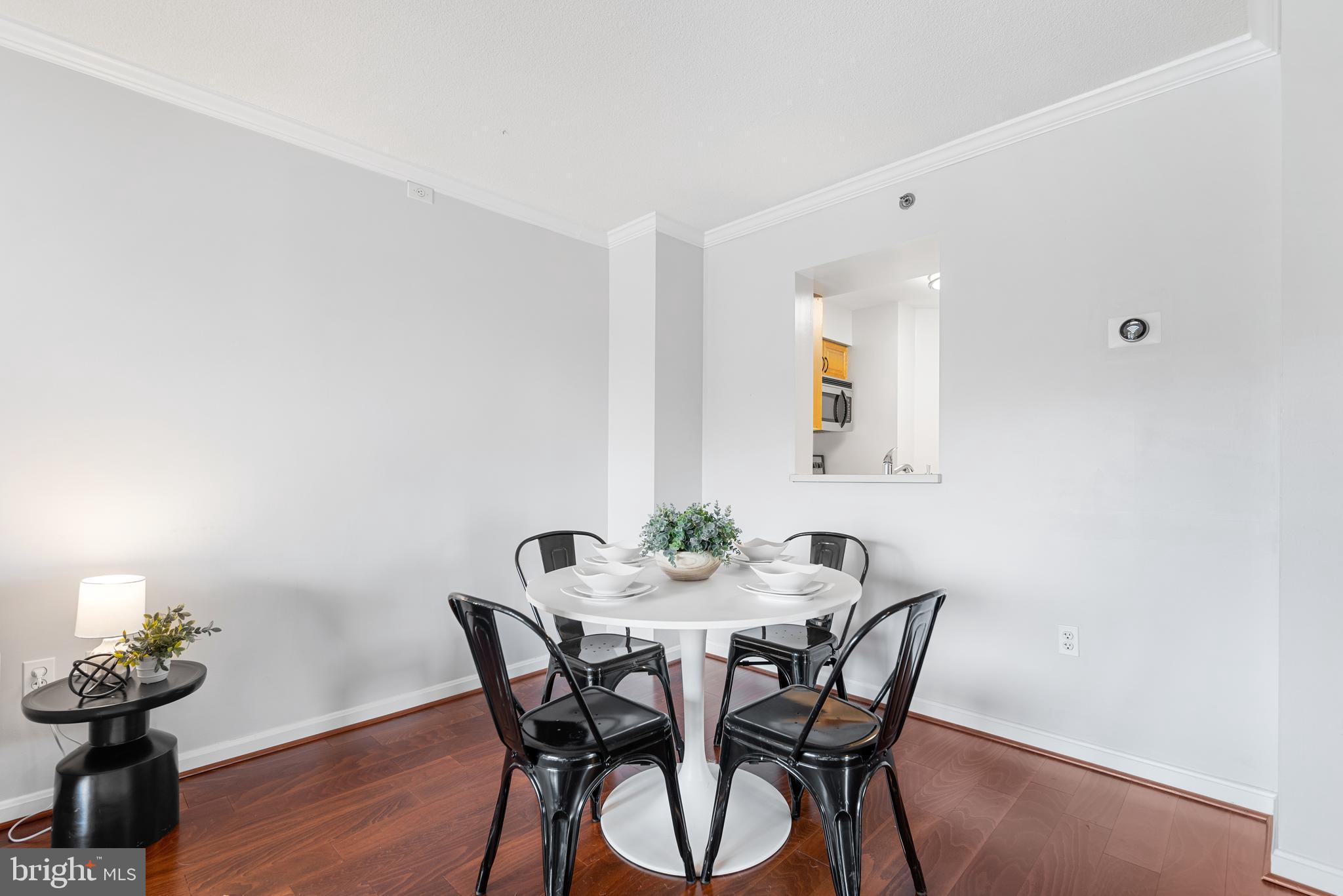 545 East Braddock Road, Unit 302 Alexandria, VA 22314 - Photo 7 of 36 a view of a dining room with furniture and wooden floor