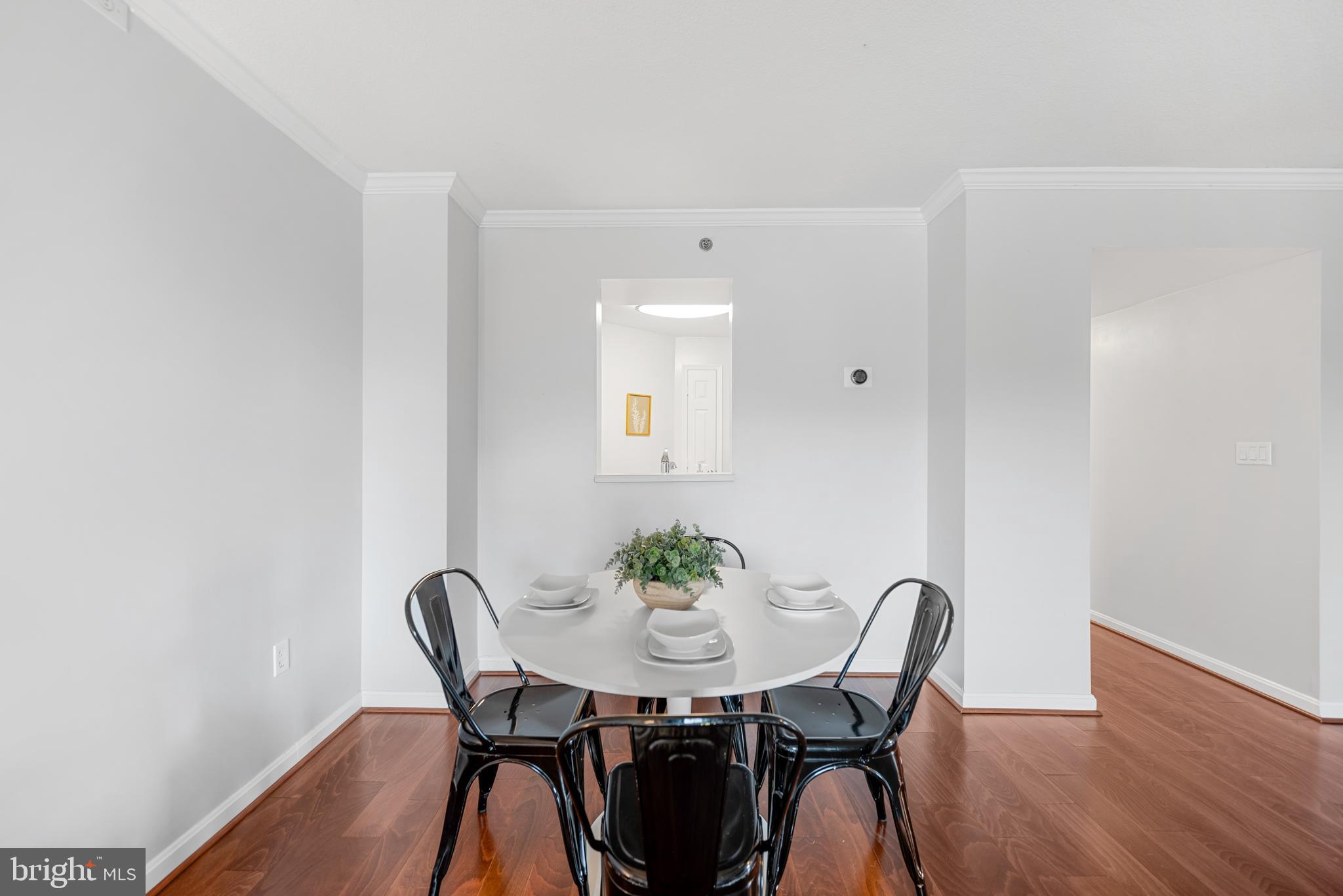545 East Braddock Road, Unit 302 Alexandria, VA 22314 - Photo 8 of 36 a view of a dining room with furniture and wooden floor