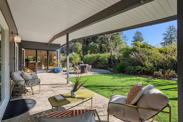 a view of yard with patio