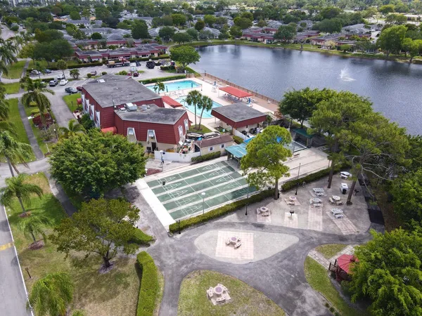 an aerial view of a house with outdoor space and lake view