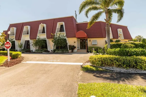 a view of a swimming pool with an outdoor seating