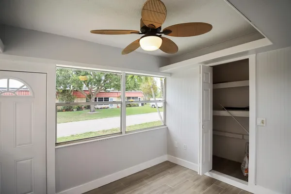 a view of room with window and chandelier