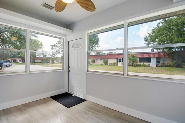 a view of an empty room with a window