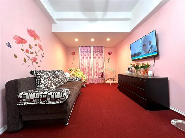 a living room with furniture and a rug