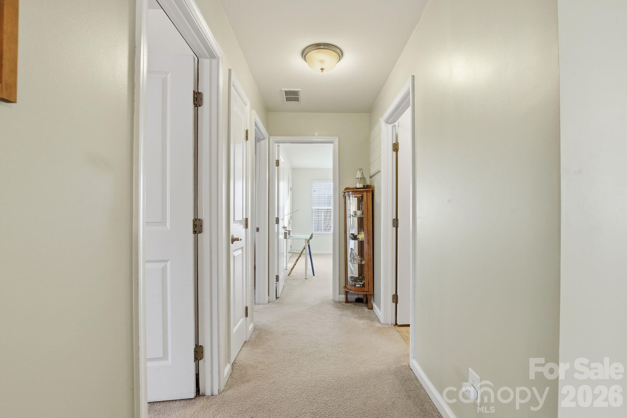7532 West Berkeley Road, Unit 25 Denver, NC 28037 - Photo 23 of 36 a view of a hallway with closet and a bathroom