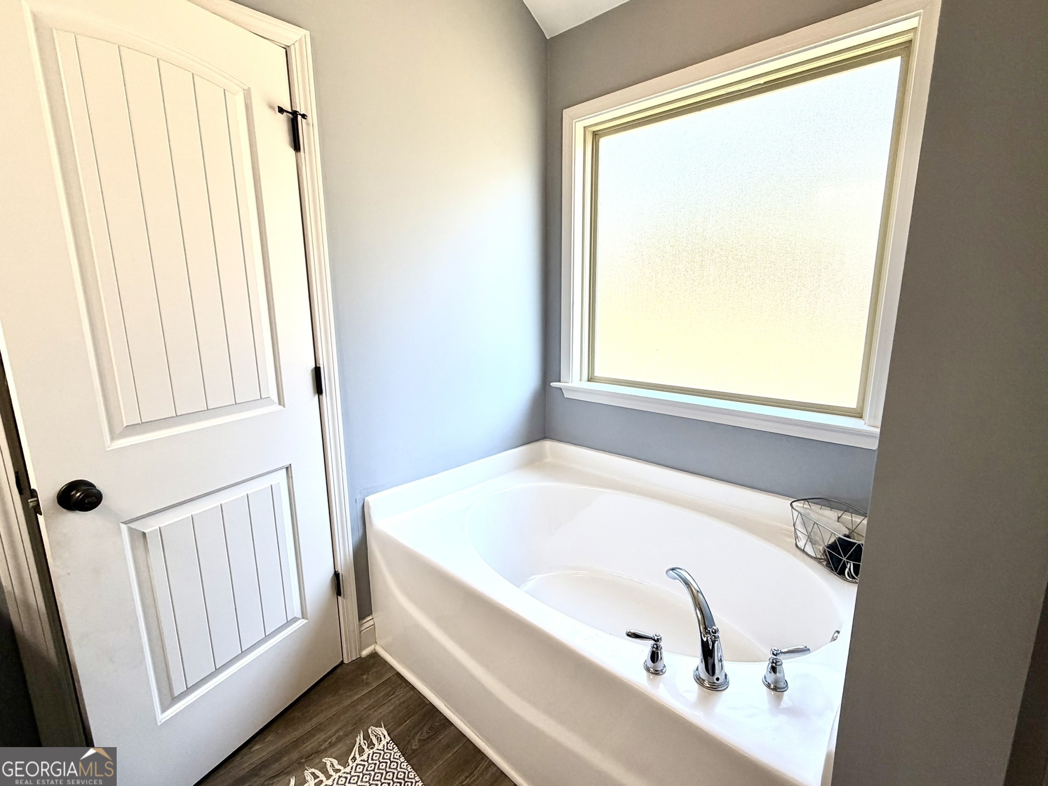 111 Bridle Path Griffin, GA 30224 - Photo 15 of 20 a bathroom with a bathtub and a window